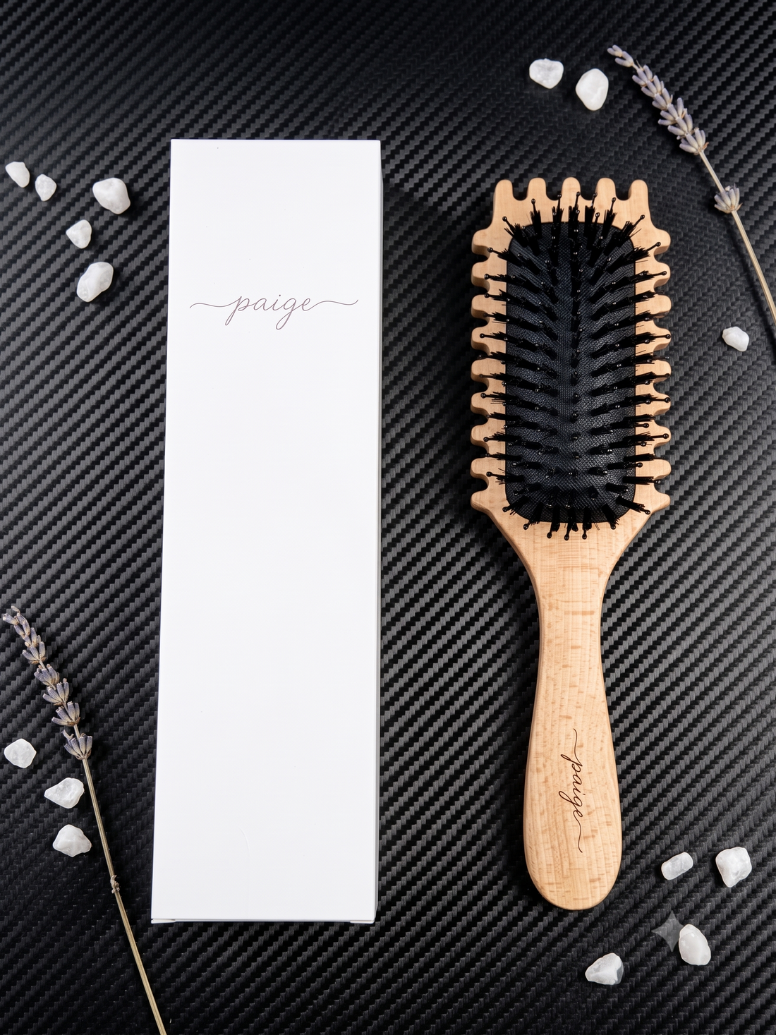 Wooden detangling brush gliding through thick, curly hair